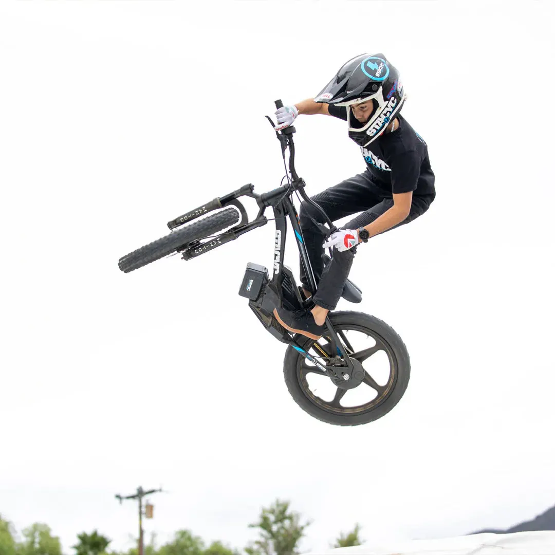 Young rider pushing a STACYC 20eDRIVE to its limits off road