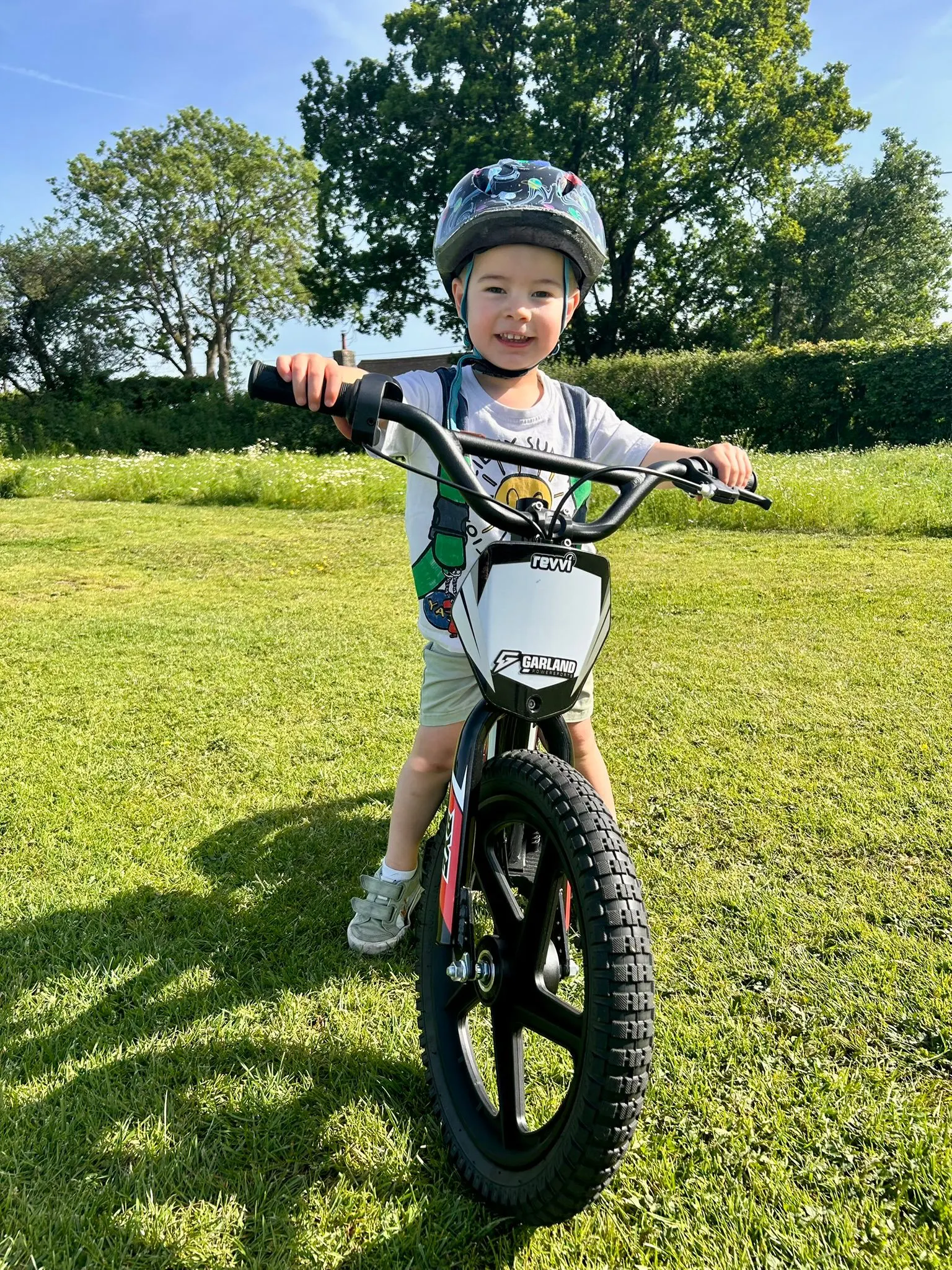 Young rider on a Revvi 16 electric balance bike